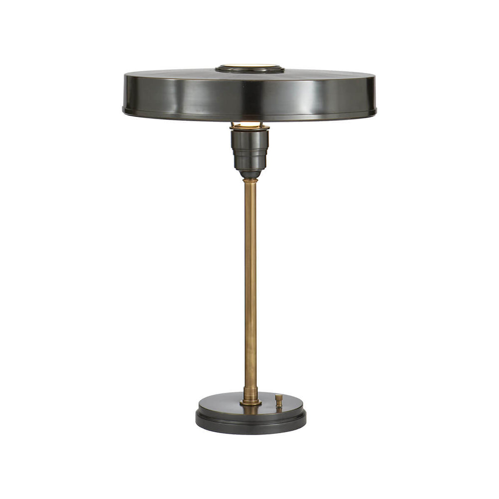 The Carlo Table Lamp is a classic metal desk lamp with a bronze finish, antique brass stem and a flat, round shade.