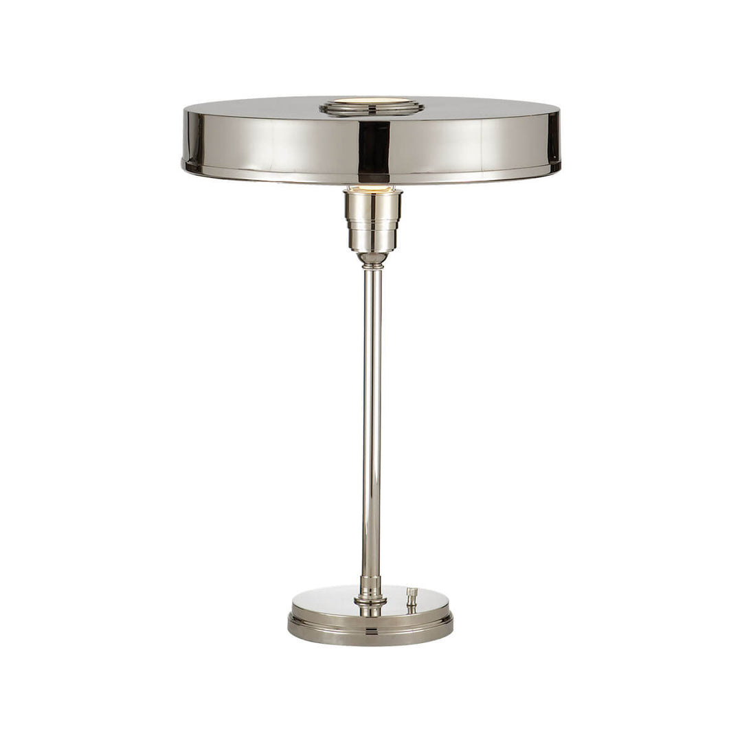 The Carlo Table Lamp is a classic metal desk lamp with a polished nickel finish and a flat, round shade.