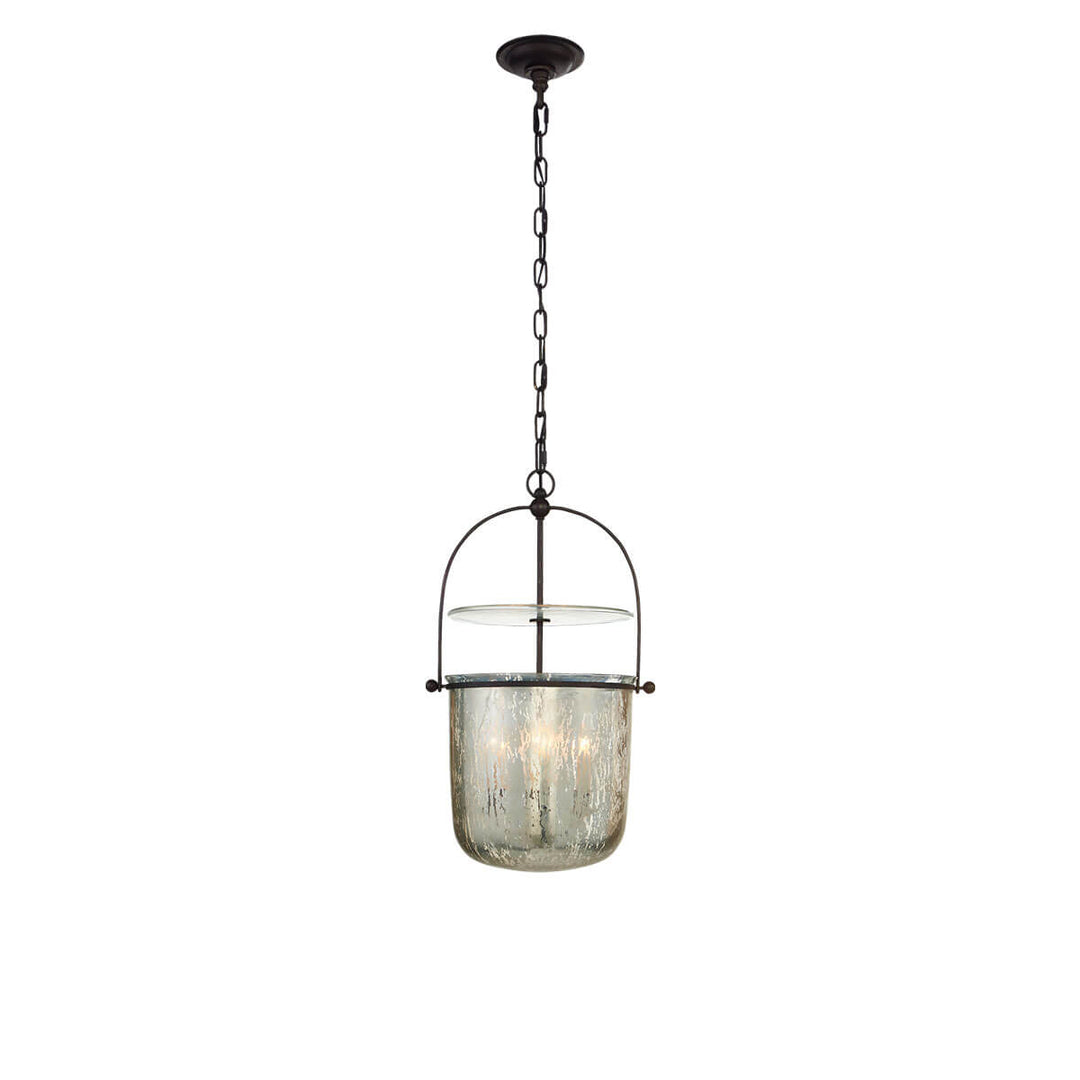 The Lorford Bell Lantern has a smokey mercury glass, bell shaped light with an aged iron chain and hardware.