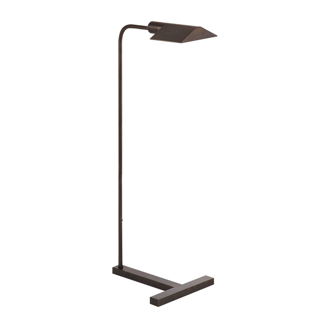 The William Pharmacy Floor Lamp that features an angled shade and sturdy, thick base. The light is finished in a dark bronze.