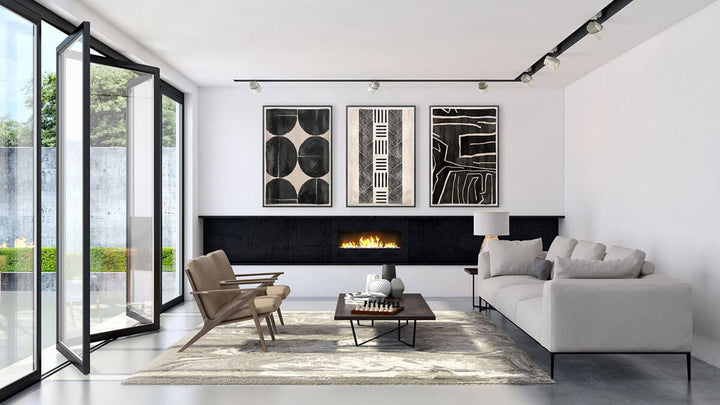 Collection of abstract, contemporary mud paintings in a modern living room.