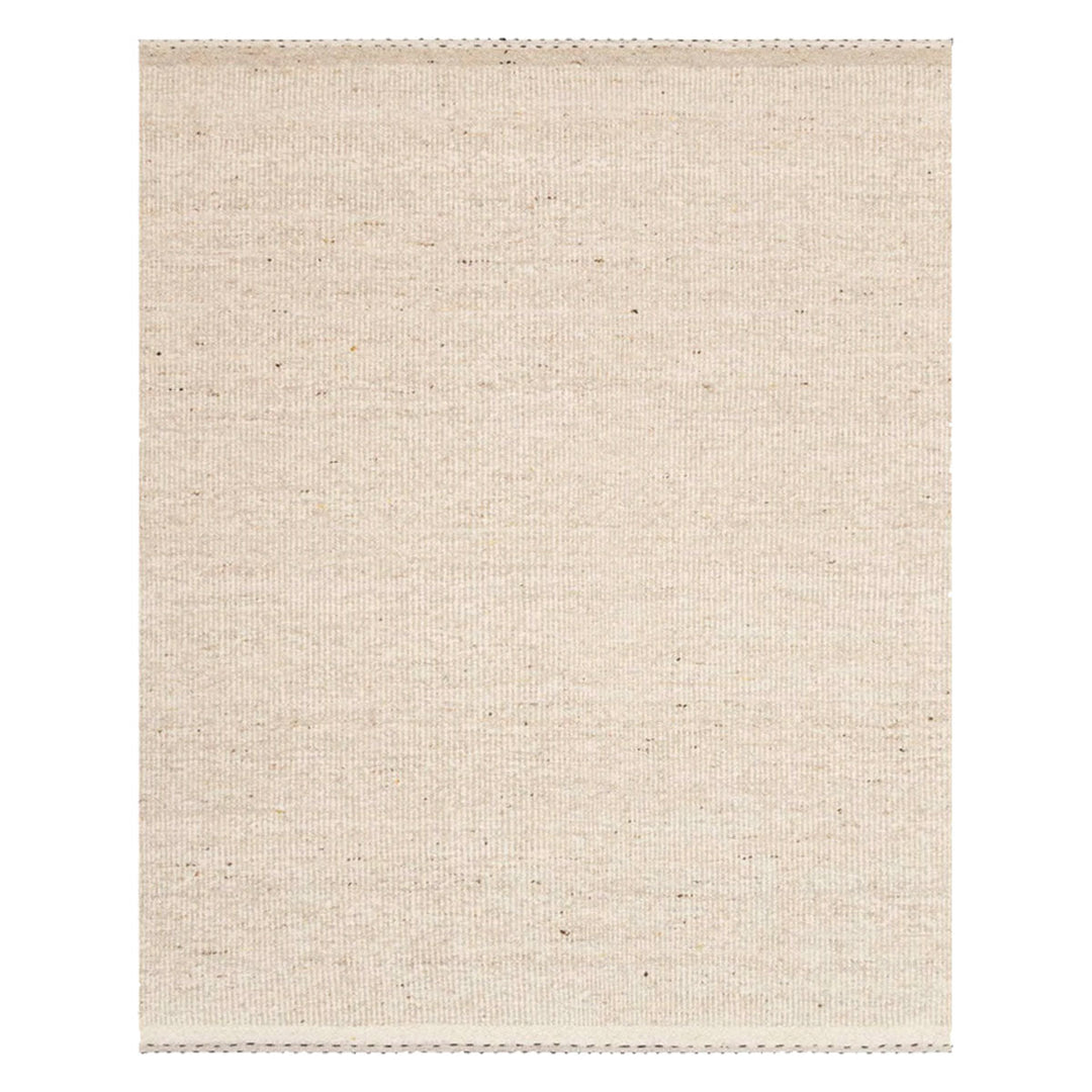 Soft, textural, oatmeal coloured rug with soft striped motifs around the ends and a minimalist appearance.