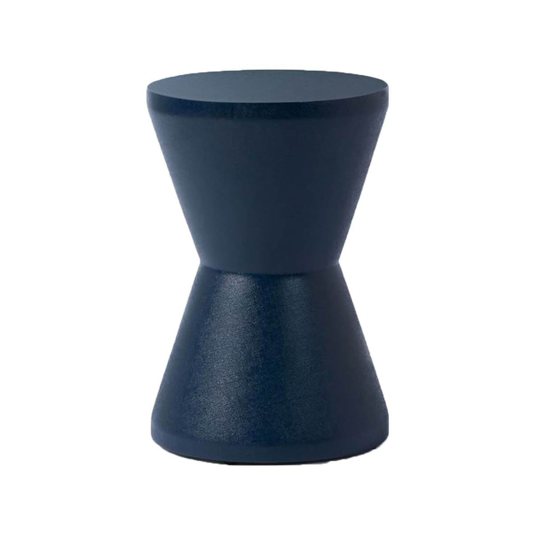 The Salerno Stool has an hourglass shape in a navy faux Belgian linen finish.