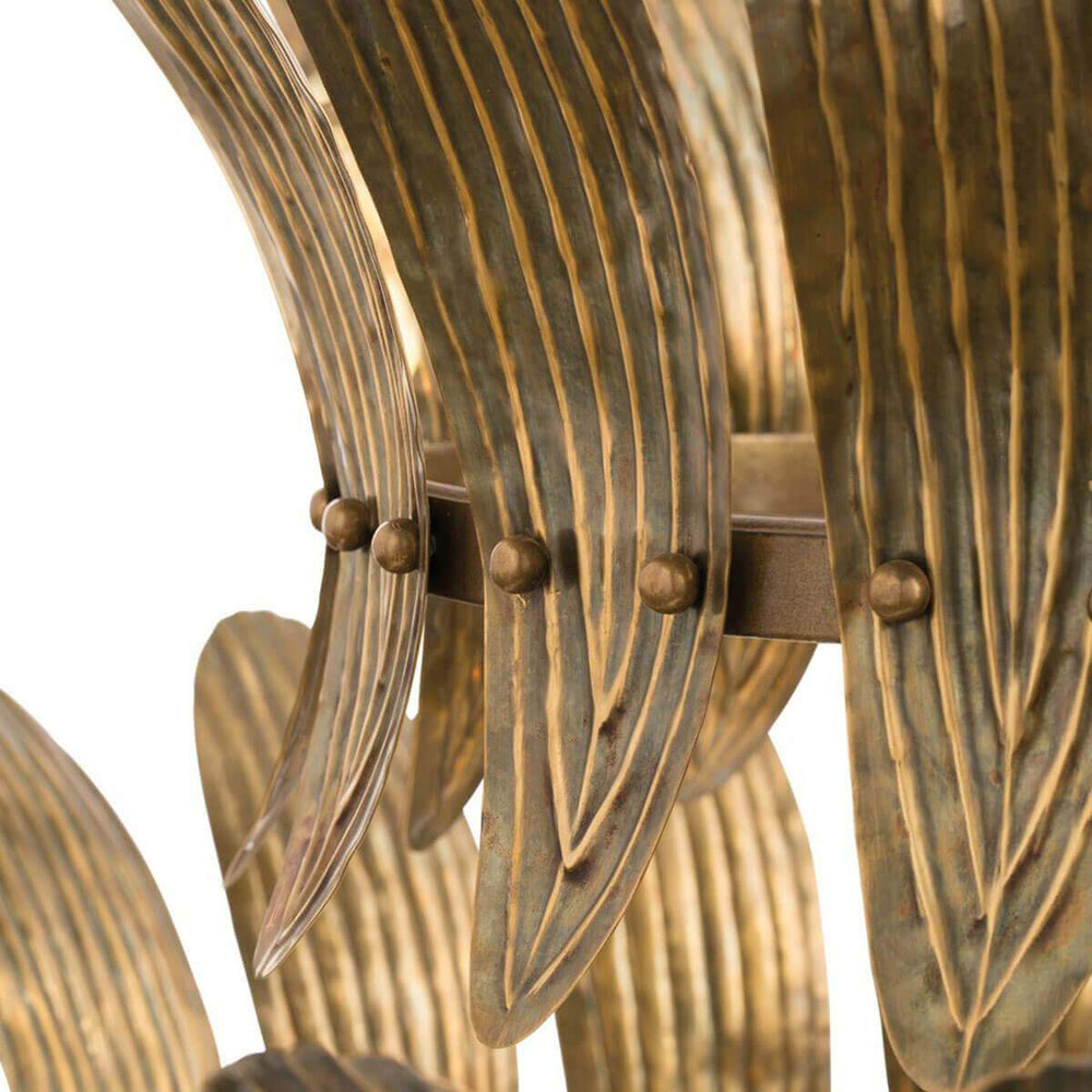 Embossed leaf pattern on the antique brass small chandelier with a vintage look.