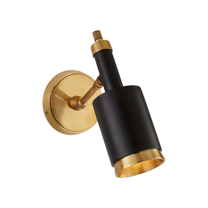 The Anders Articulating Wall Sconce is an articulating wall light in a hand-rubbed antique brass finish with white accents and a modern shape.