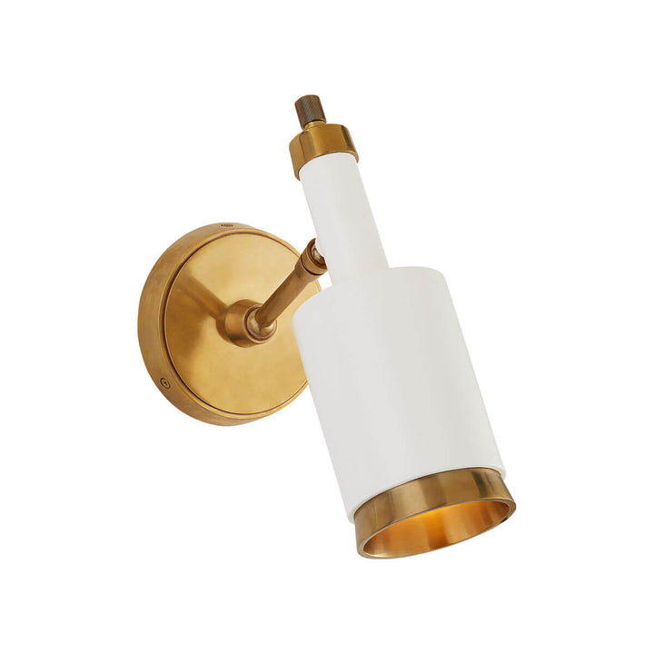 The Anders Articulating Wall Sconce is an articulating wall light in a hand-rubbed antique brass finish with brass accents and a modern shape.
