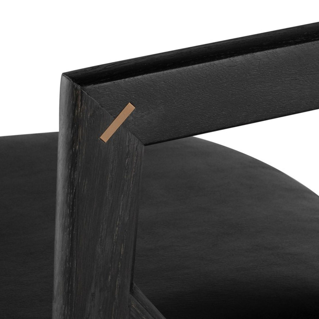Close up of the detail on the arms of the black oak and leather Anson Black Dining Chair.