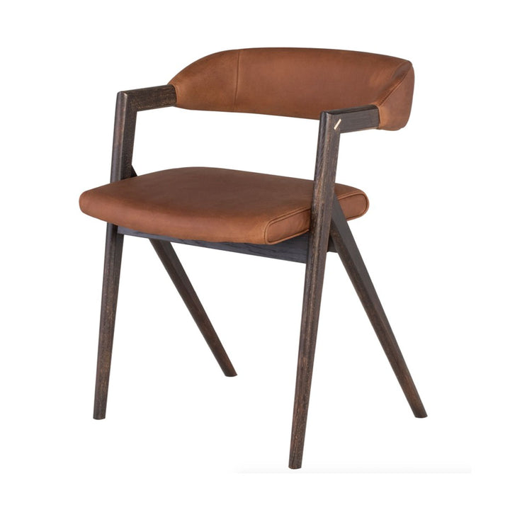 This modern dining chair is made of a cognac leather seat with a seared oak wood frame.
