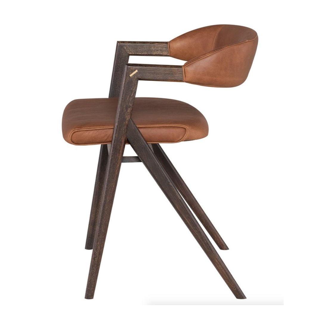 The side view of the Anson Cognac Dining Chair shows off the long angled legs that add an interesting detail to this chair.