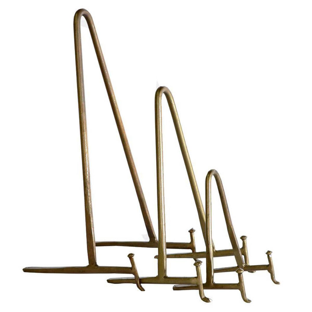 The Antique Brass Display Stand come in three sizes and help display artwork or books.
