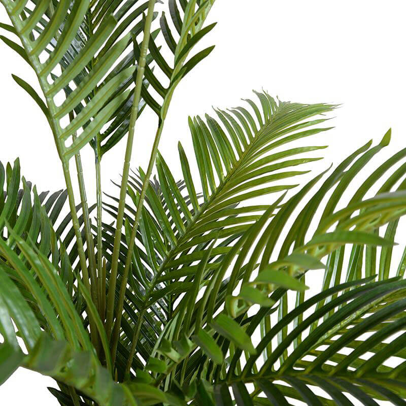 Slender, arching leaves on an artificial tropical plant.