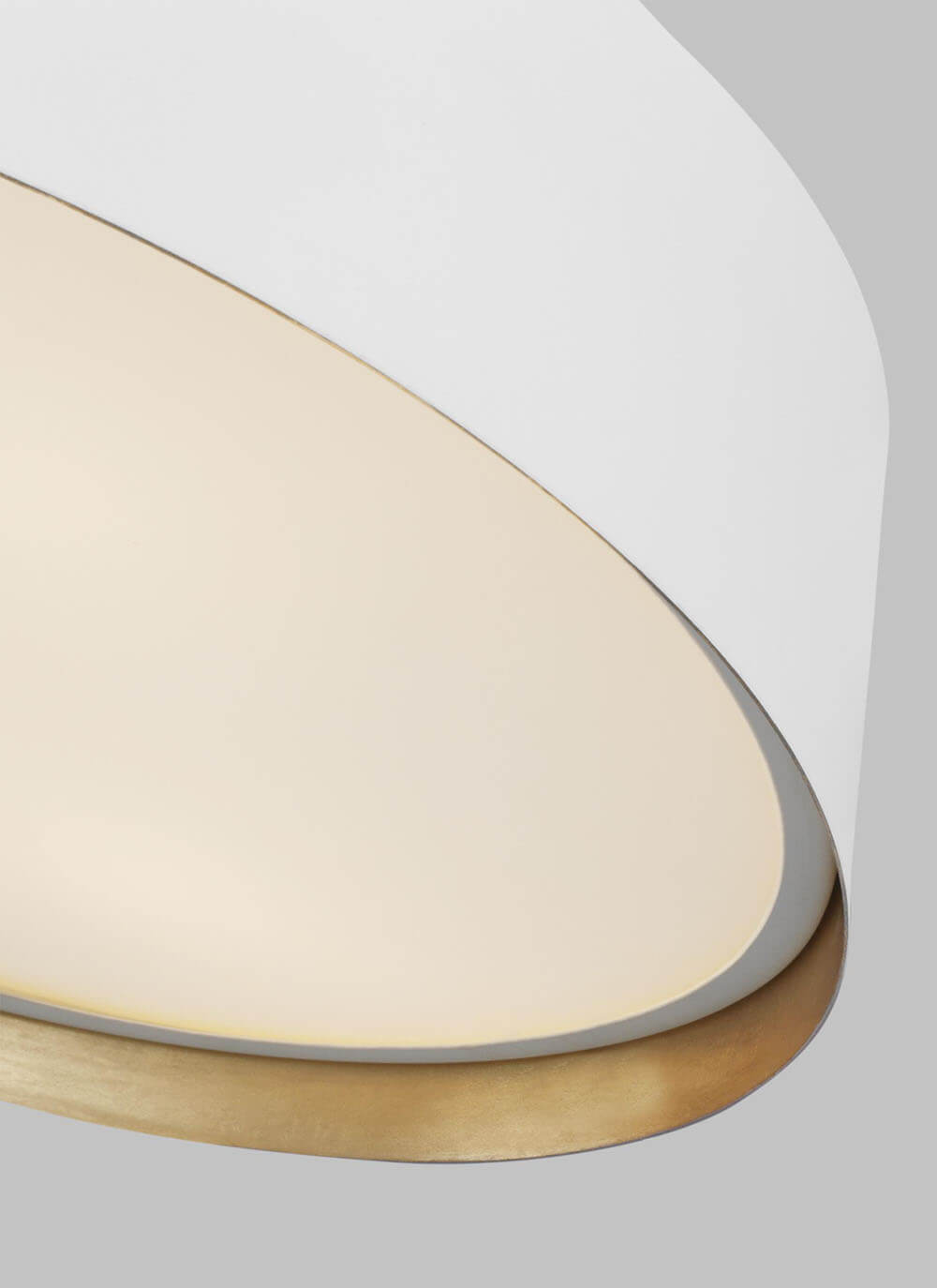 Inner gold details on the matte white, minimal flush mount lighting.