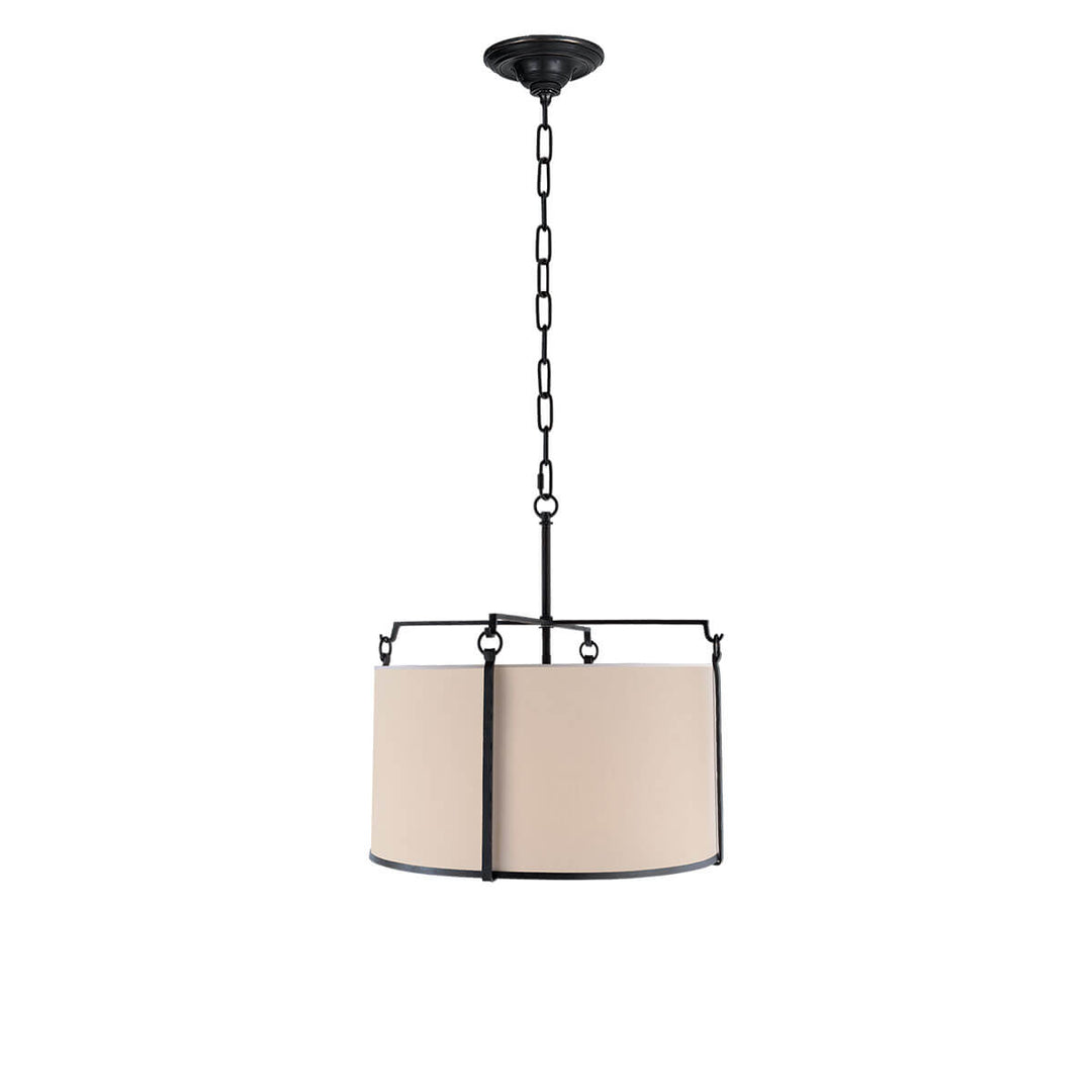 The Aspen Hanging Shade has natural paper cylindrical shade with blacked rust metal frame and chain attachment.