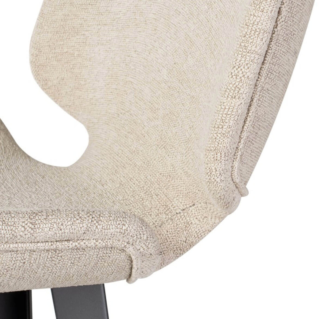 Boucle upholstered seat and seaming details on the modern counter stool.