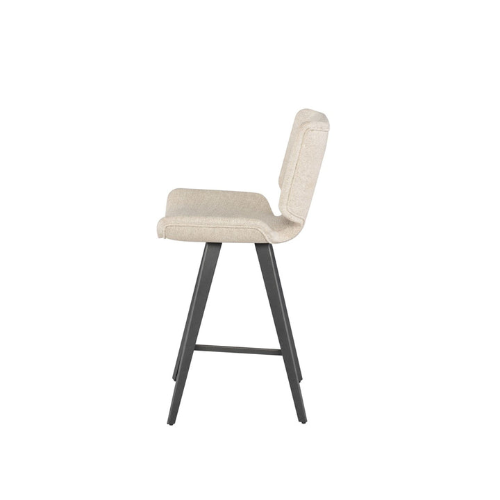 Side view of the off white modern counter stool with a large, upholstered seat and dark grey legs.
