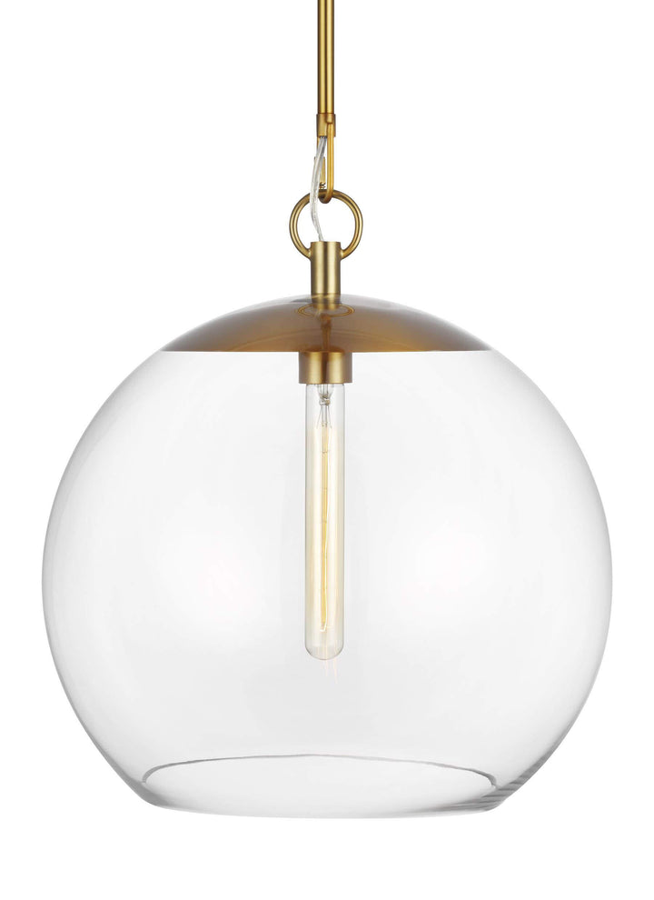 Glass globe pendant with modern bulb and a burnished brass finish.