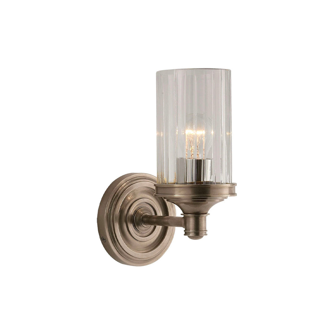 Classic single sconce combining antique nickel with crystal glass.