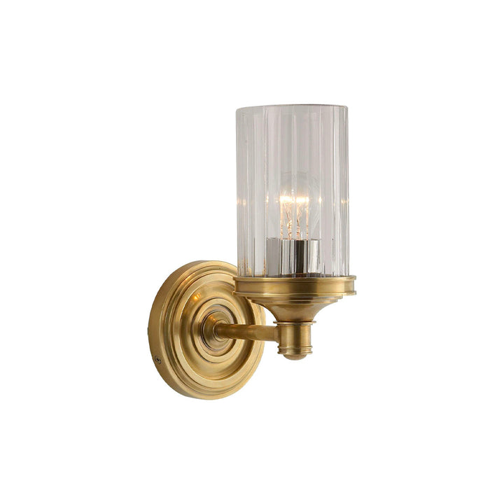 A classic piece combining hand-rubbed antique brass with crystal glass.