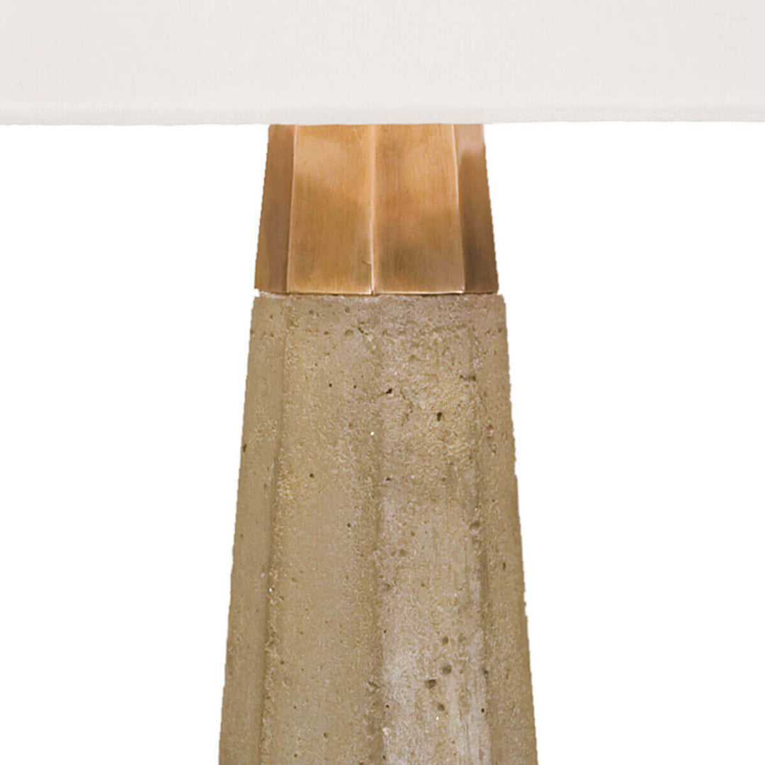 Brass details and tapered, hexagon concrete base on the Rochdale Table Lamp.