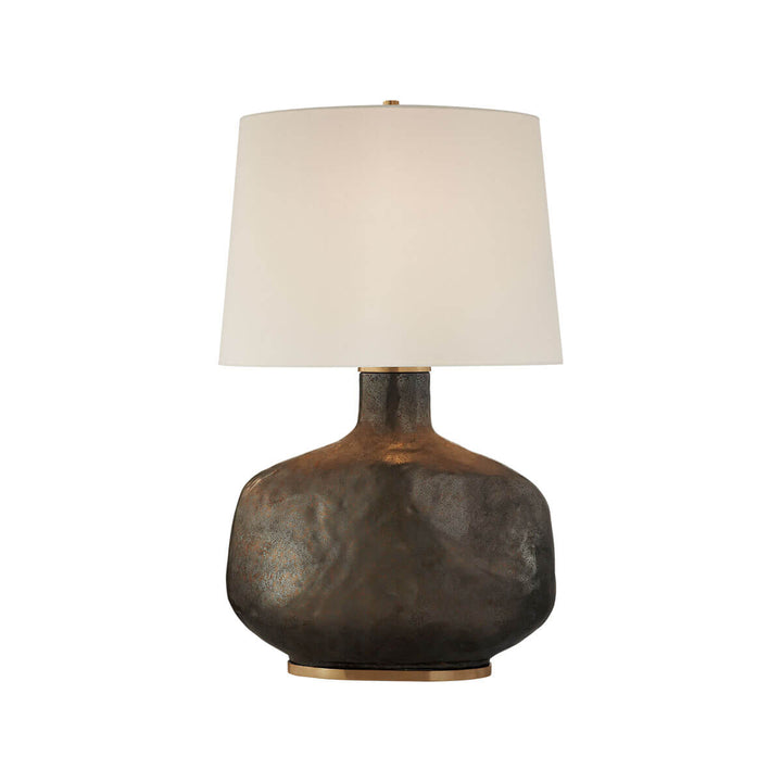 Beton Table Lamp Lamp has a crystal bronze sculptural base with a neutral linen shade.