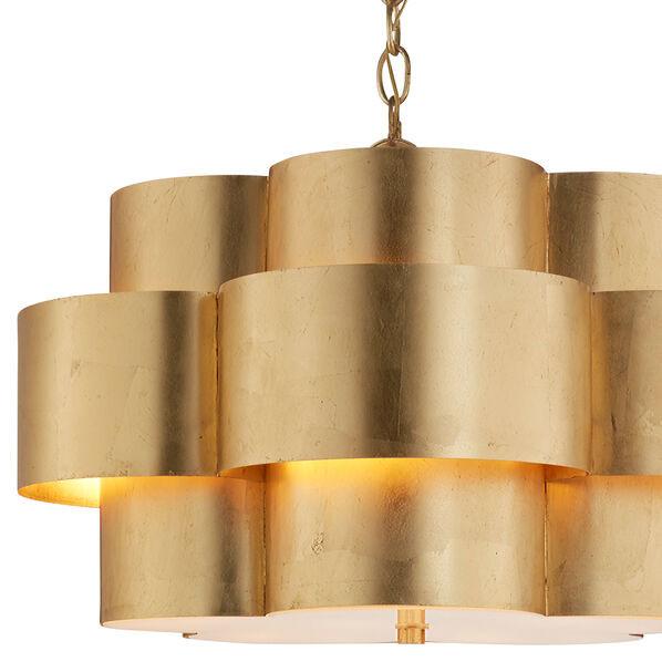 Closeup of the glamorous gold chandelier with a scalloped shape.