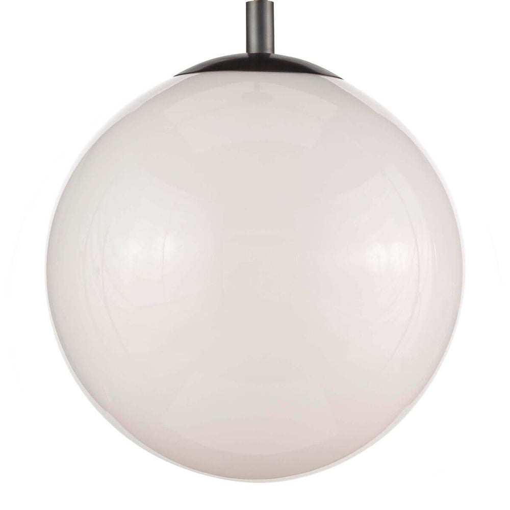 Closeup of the opal glass, round pendant light with black metal hardware.