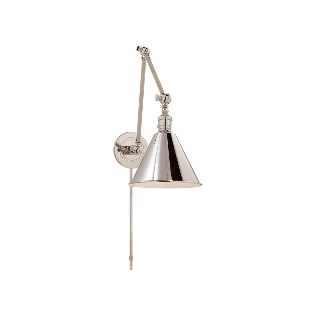 The Boston Double Arm Wall Light is an adjustable wall sconce with a round backplate in a polished nickel finish.