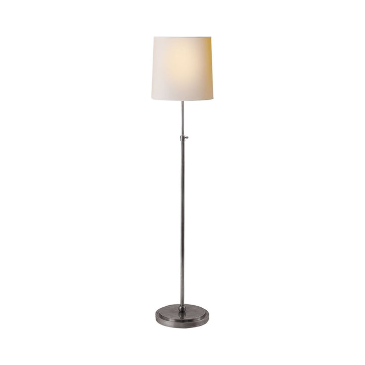 Traditional simple floor lamp in antique silver with a paper shade.
