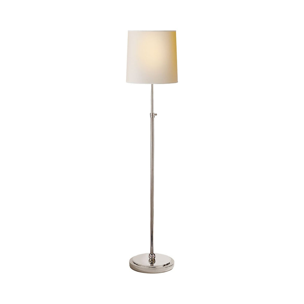 Traditional simple floor lamp in polished nickel with a paper shade.