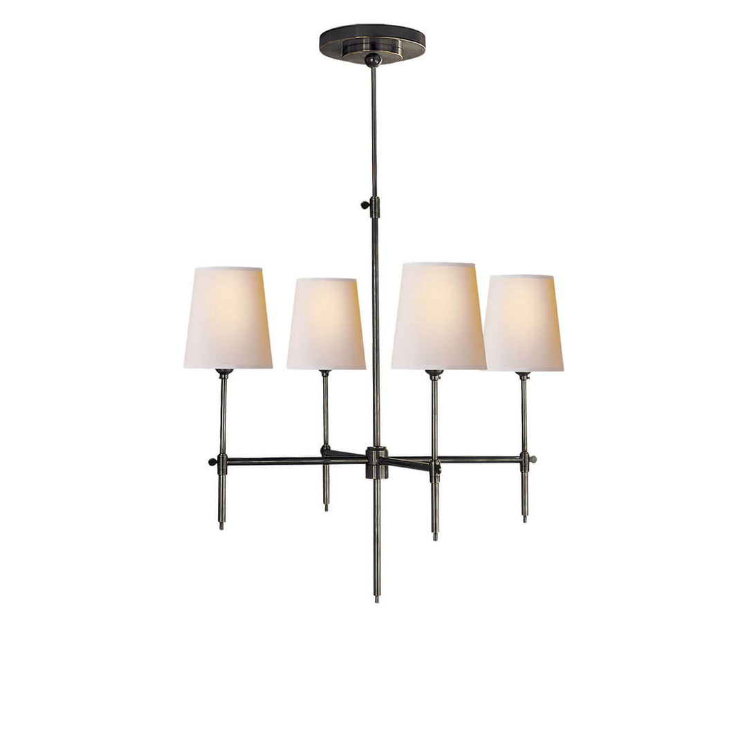 The Bryant Chandelier has a traditional candelabra frame with bronze arms and four lights with natural paper shades.