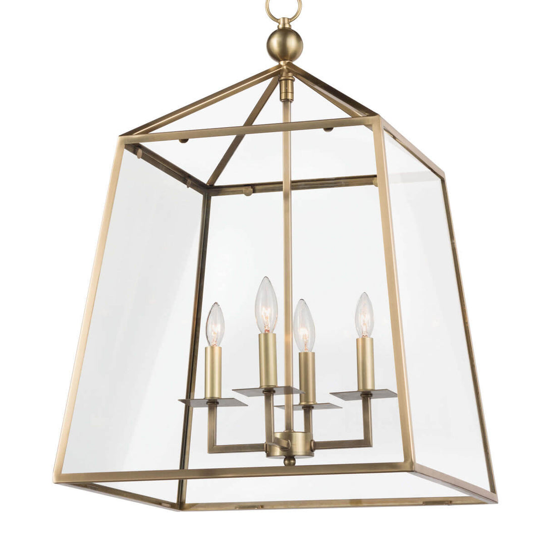 Dining room lantern pendant light with a brass finish and chain detail.