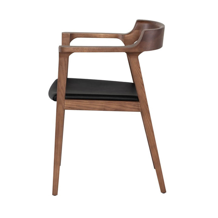 Side view of the midcentury modern dining chair with rounded back, black leather seat and solid walnut wood frame.