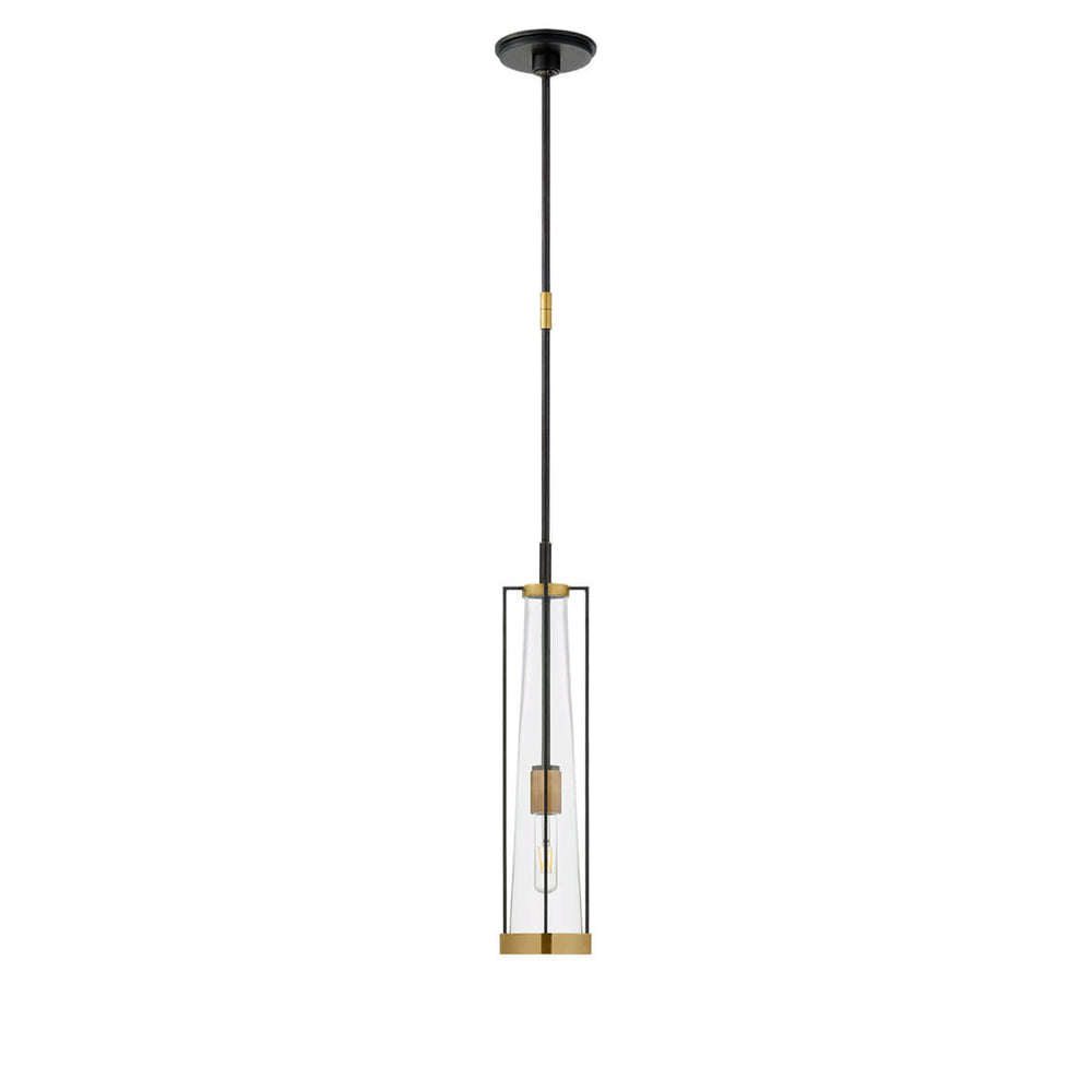 The Calix Tall Pendant has a tall, slim bronze cage with brass details around a clear glass, cylinder shade.