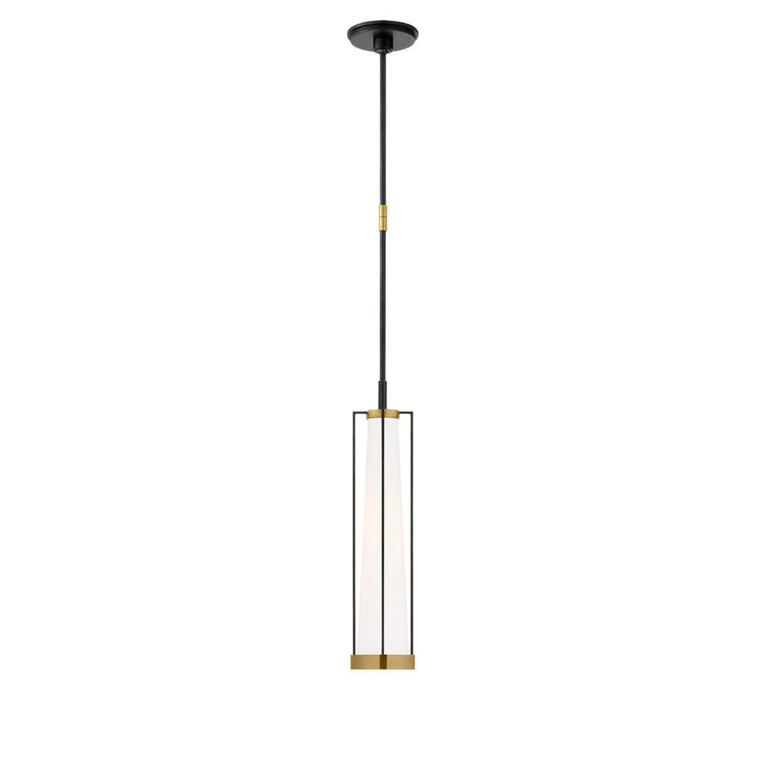 The Calix Tall Pendant has a tall, slim bronze cage with brass details around a white glass, cylinder shade.