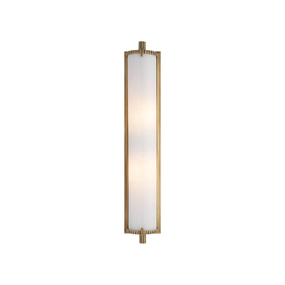 The Calliope Wall Sconce is a long, slim light with an antique brass finish and a white glass lamp shade.