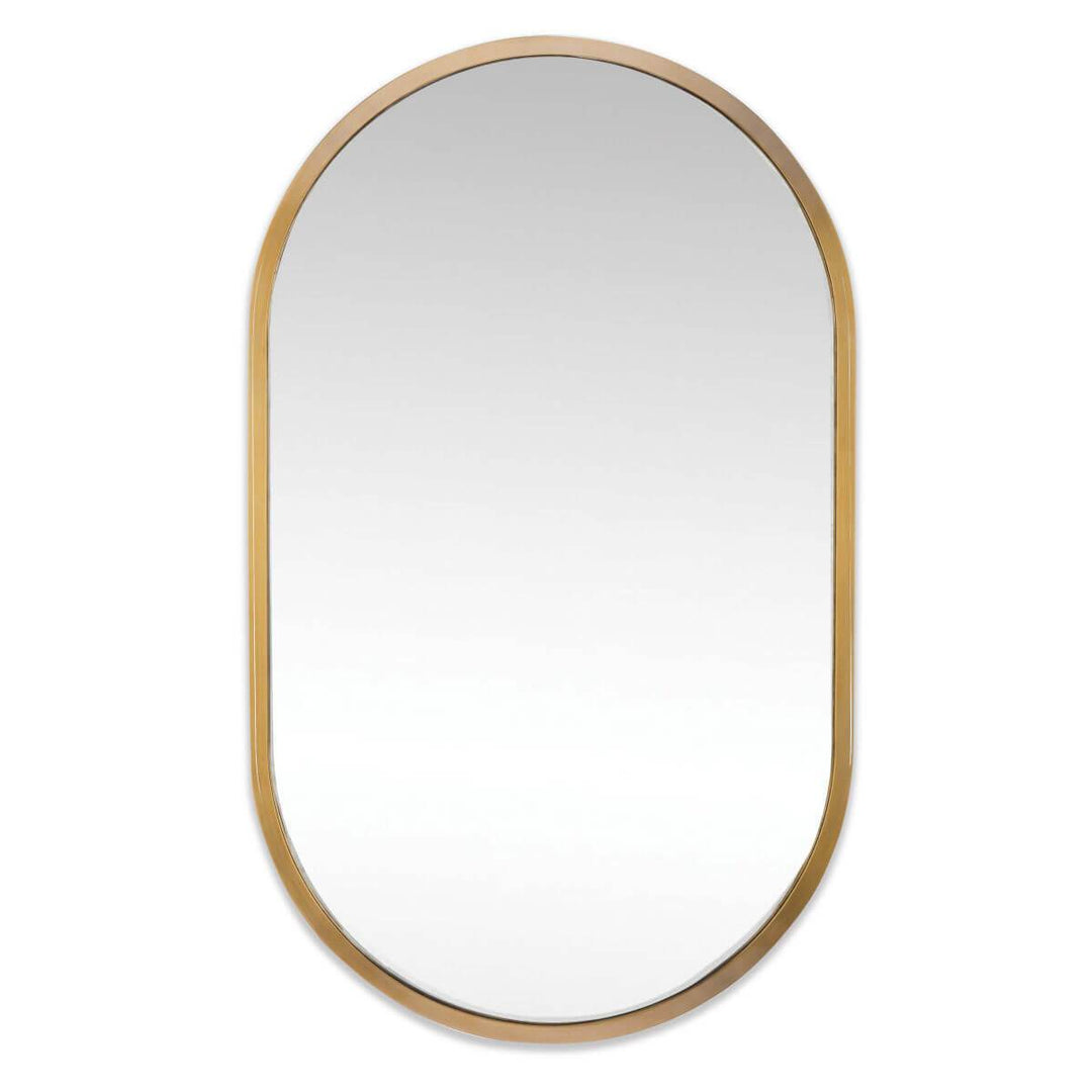 The Almere Mirror has a natural brass arched frame and an elongated oval mirror.
