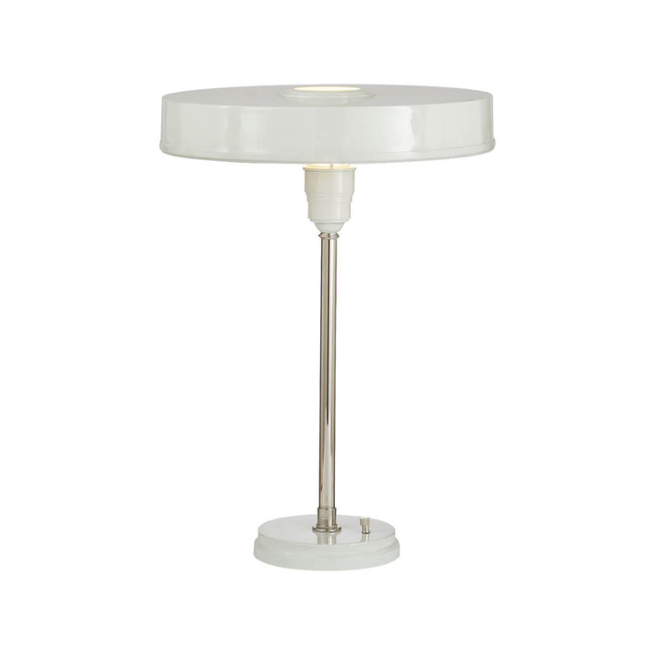 The Carlo Table Lamp is a classic metal desk lamp with an antique white finish and a flat, round shade.