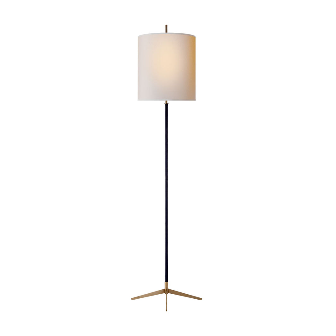 The Caron Floor Lamp has an x-shaped base in a bronze finish with an antique brass base and a natural paper closed op shade.