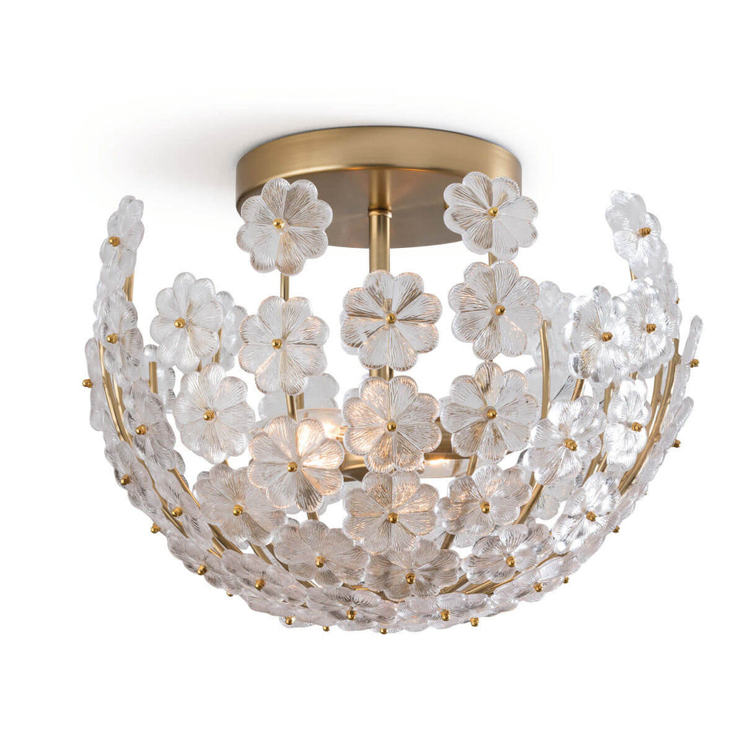 The Veneta Semi Flush Mount has a natural brass frame and canopy with cast glass flower bowl shaped shade.