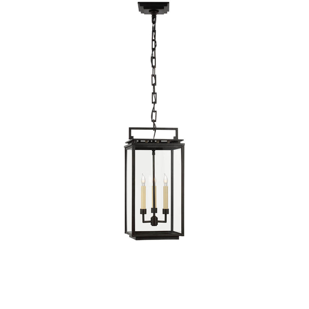 The Cheshire Hanging Lantern has an aged iron rectangular frame with three interior candle lights.