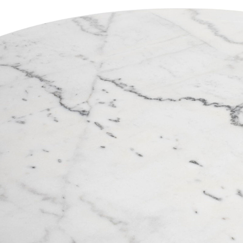 White marble details on the round, pedestal dining table.
