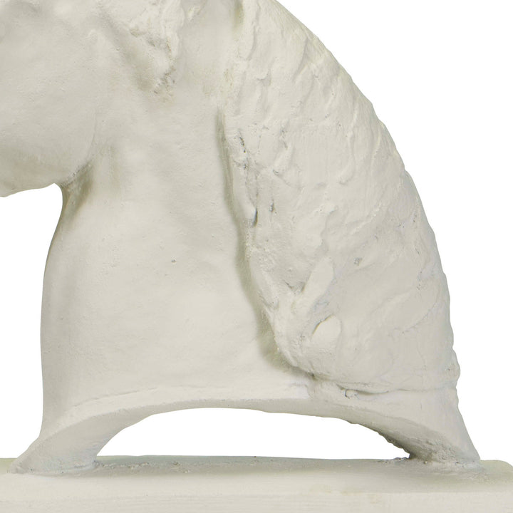 Close up of base on horse head sculpture made of resin in a white finish.