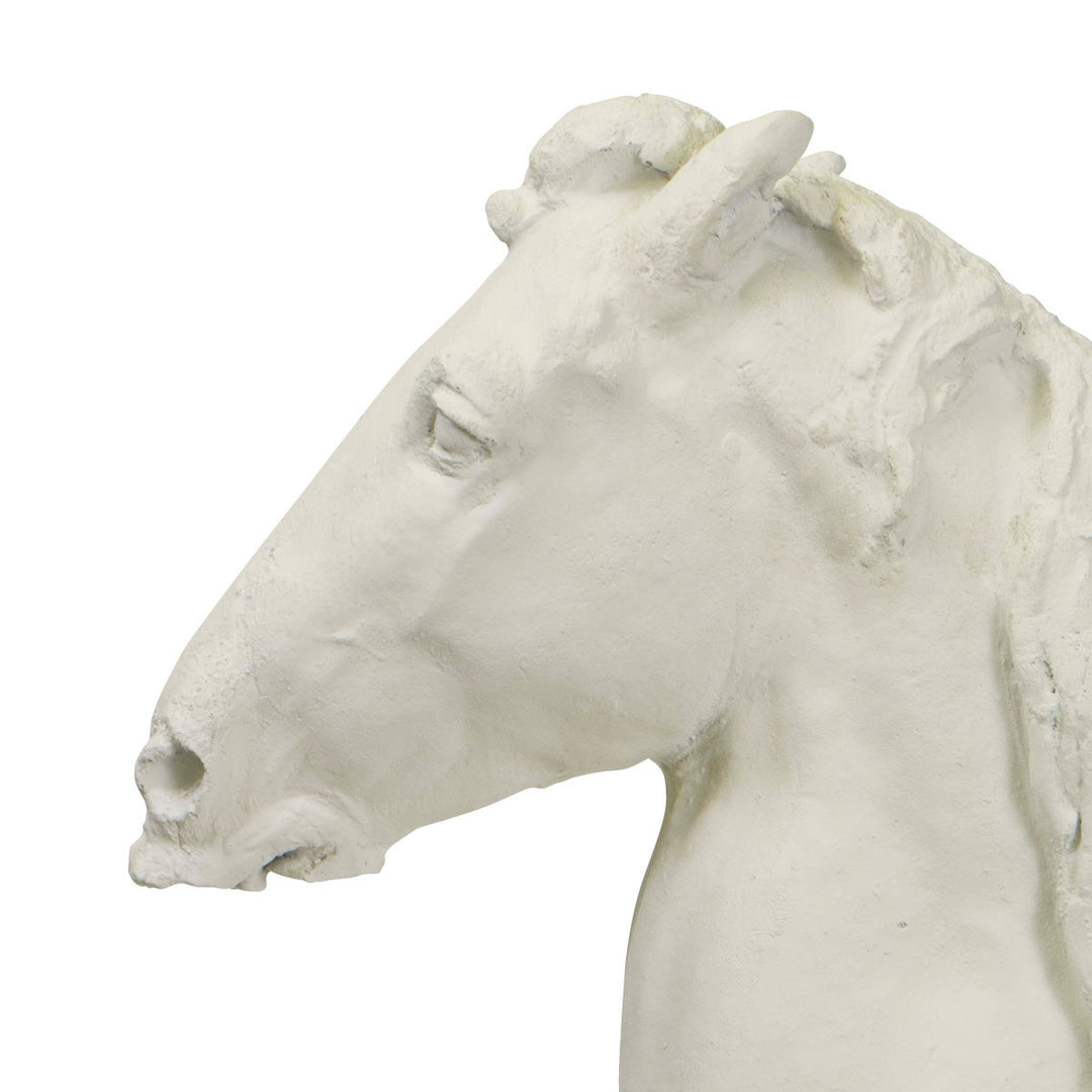 Close up of face on horse head sculpture made of resin in a white finish.