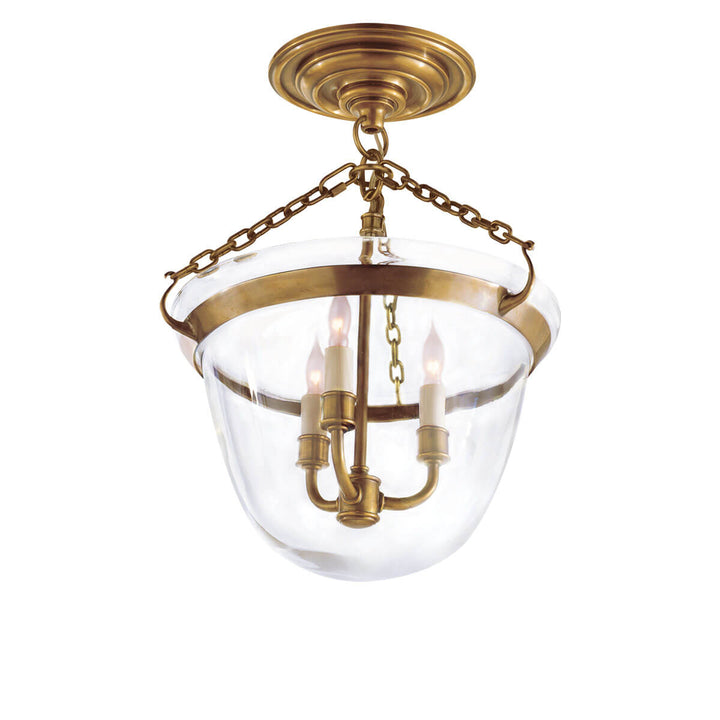 The Country Semi-Flush Bell Jar Lantern is a semi flush light with a bell shaped glass shade, candle-lick lights and antique burnished brass chain and accents.