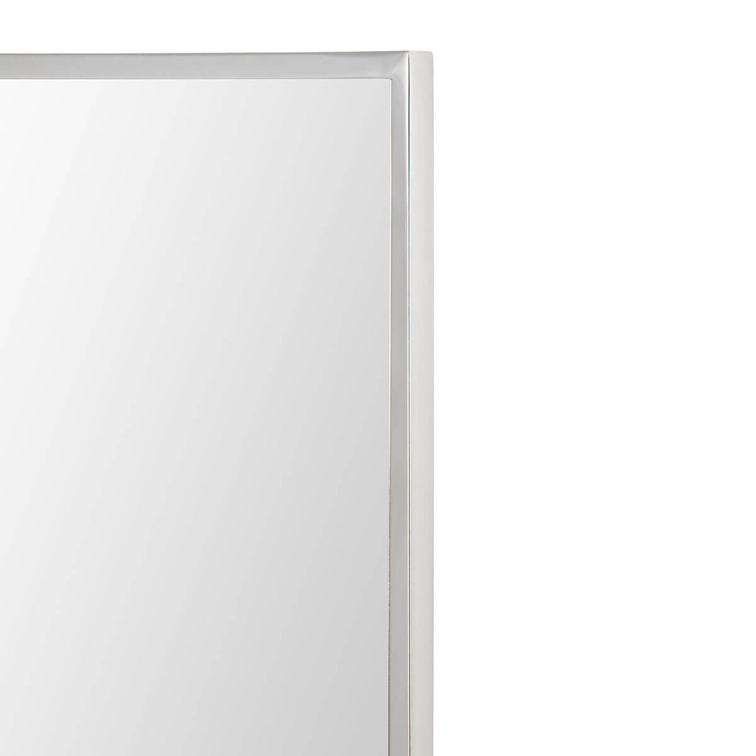 Polished stainless steel frame on a large bathroom mirror.