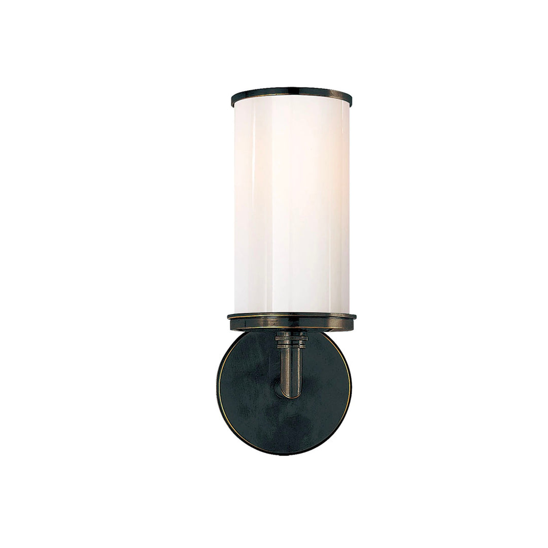 Cylinder Sconce in bronze is a simple sconce with white glass. Meant to compliment a bathroom vanity.