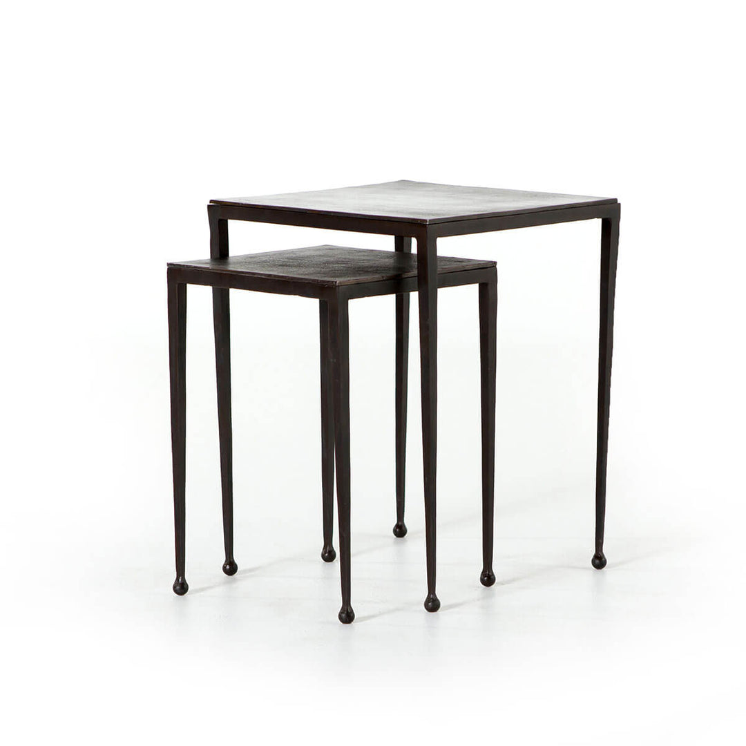 The Brechin Nesting Side Tables have tapered legs with rounded feet are made with aluminum with a rich rust finish.
