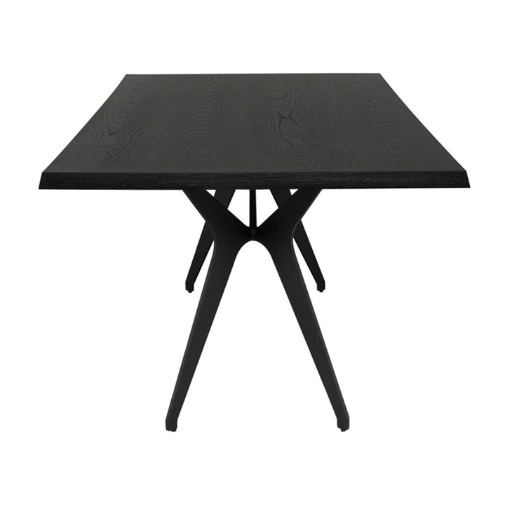End view of the black Saratov Dining Table with angled, stainless steel legs and a rectangle top.