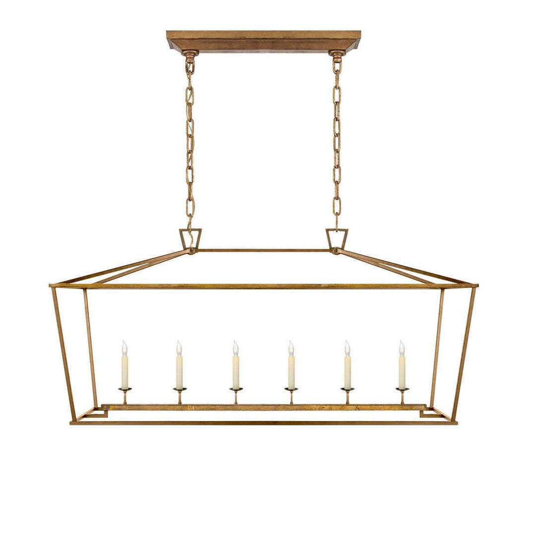 The Darlana Large Linear Lantern Lantern is a gilded iron metal lantern frame with five candle-like lights.