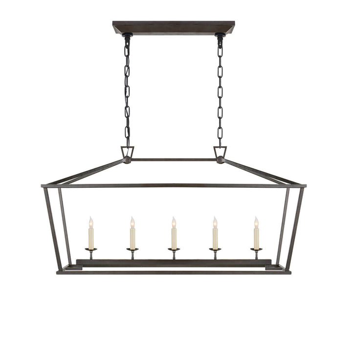 The Darlana Linear Lantern is an aged iron metal lantern frame with five candle-like lights.